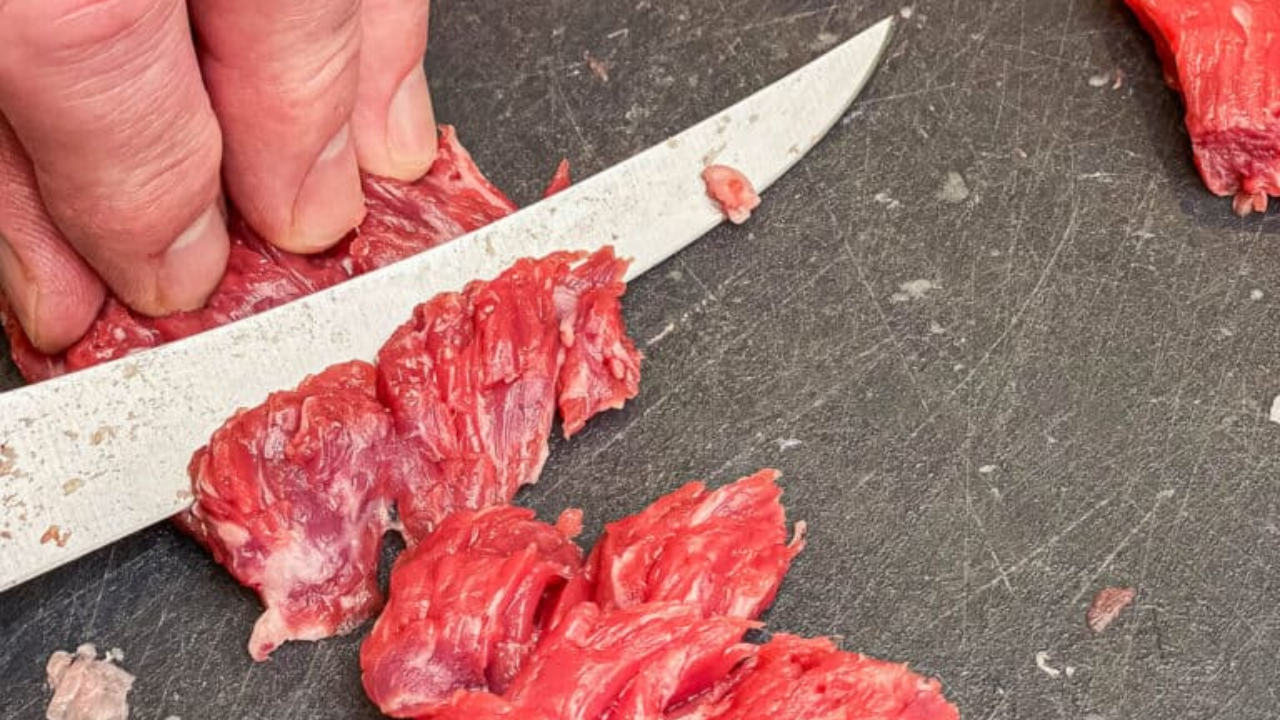 Meat sliced into steaks, marinating.