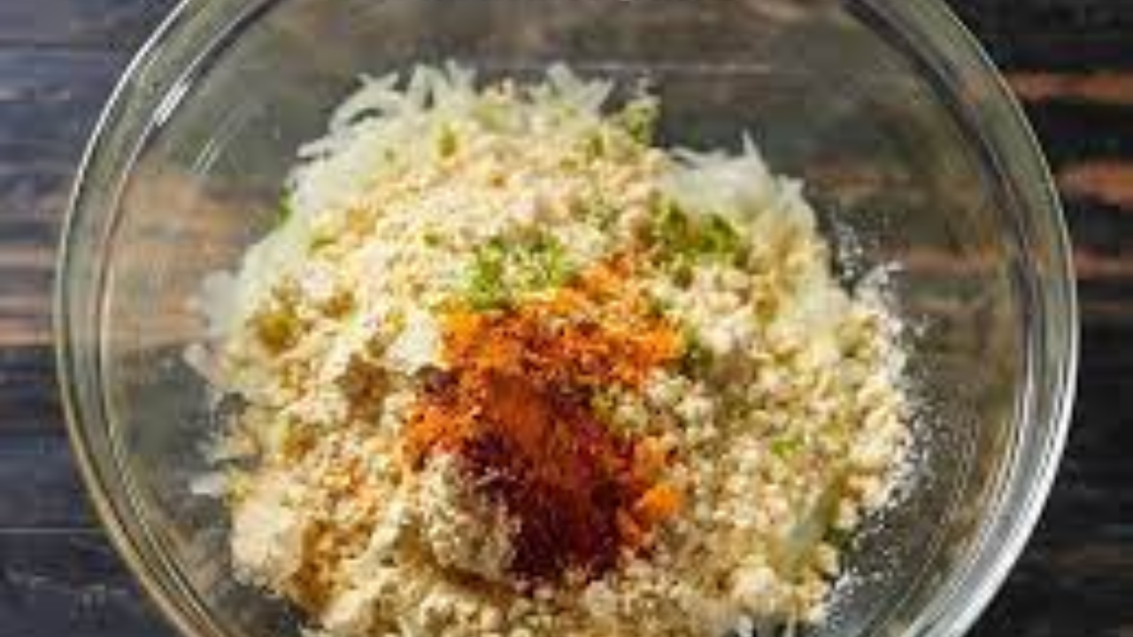 Mixing pumpkin, spices, and gram flour for koftas