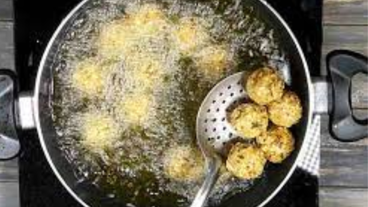 Frying Poha Pakoras in a pan