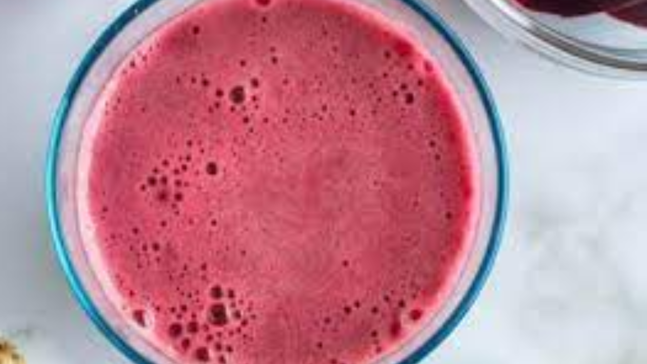 Pouring Beetroot Delight mixture into a pan on the stove