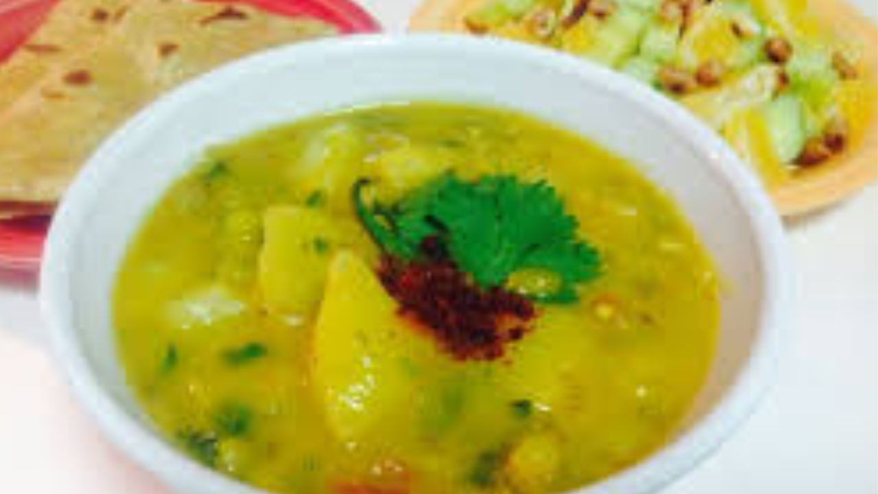 Raw Mango and Gram Flour Curry With Parathas