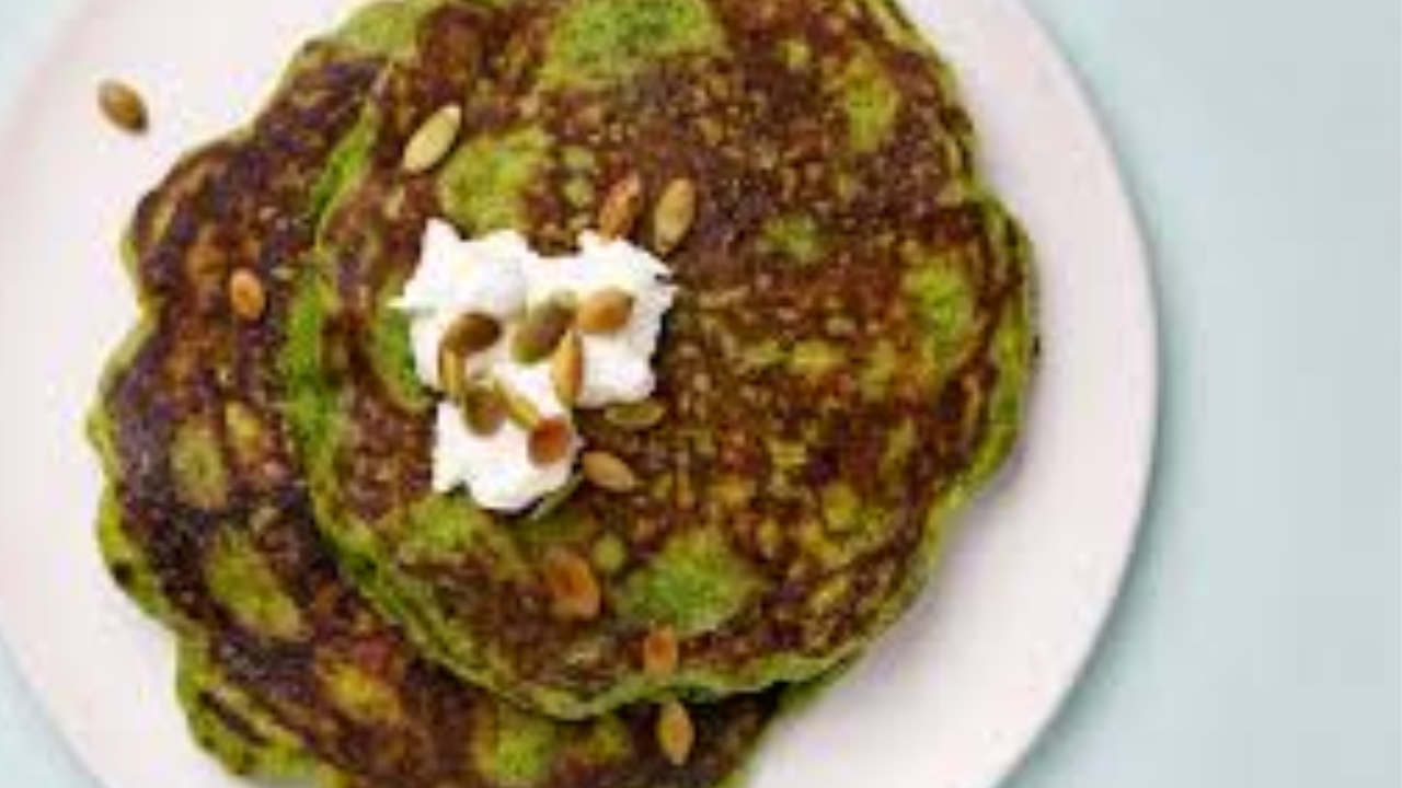 serving spinach pancakes with grated cheese